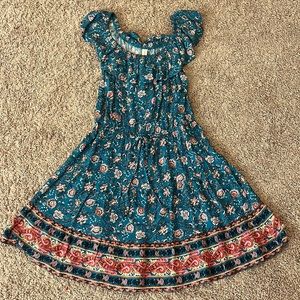 This is a bebop dress, color is teal with flowers and is size small in women’s